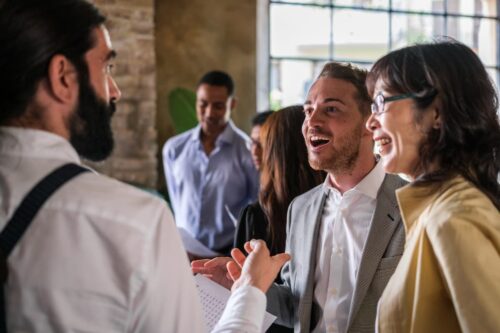 two people discussing a partnership at an association event