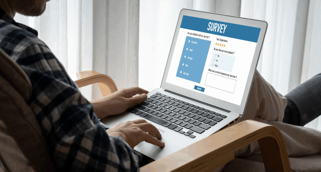 Man on his laptop taking an online survey 