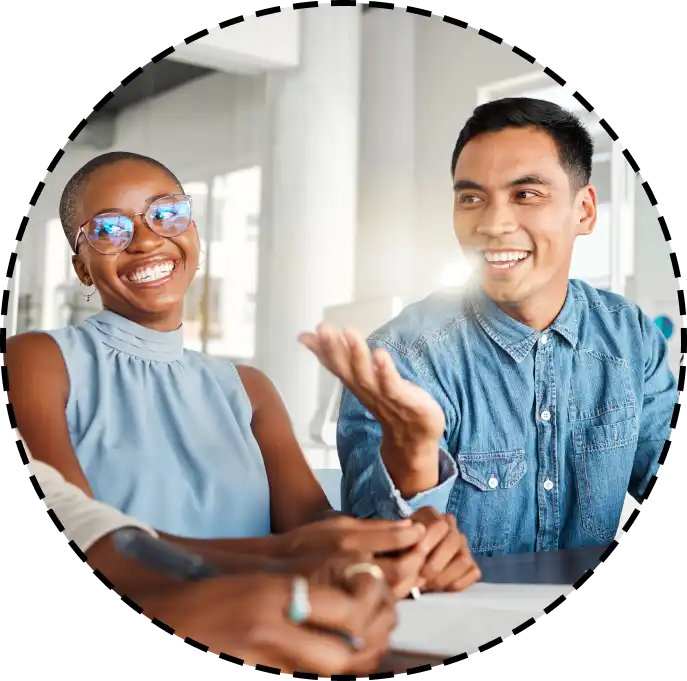 colleagues laughing in a group meeting