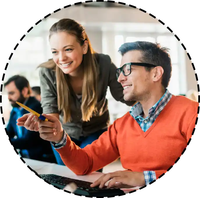 coworkers looking at a screen