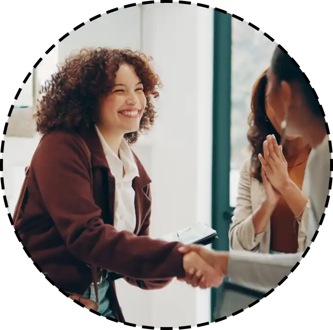 women shaking hands after meeting